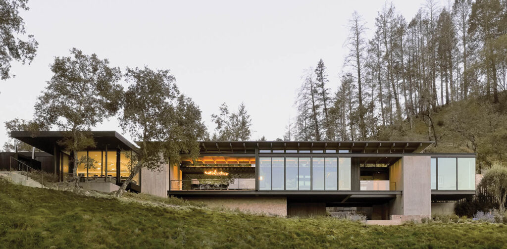facade of single-level country home surrounded by trees