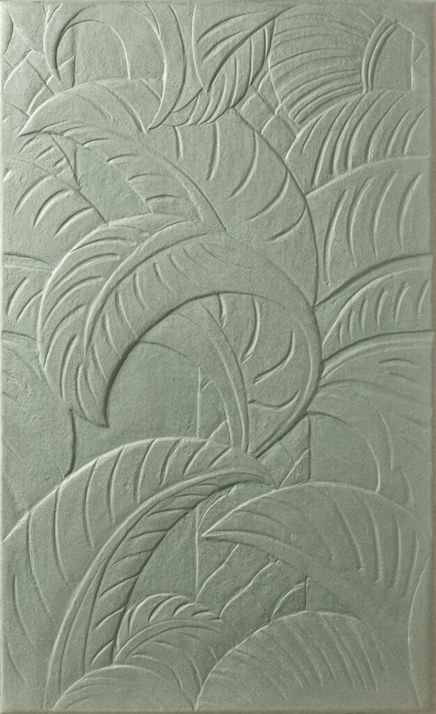 leaf detail on a pale green tile