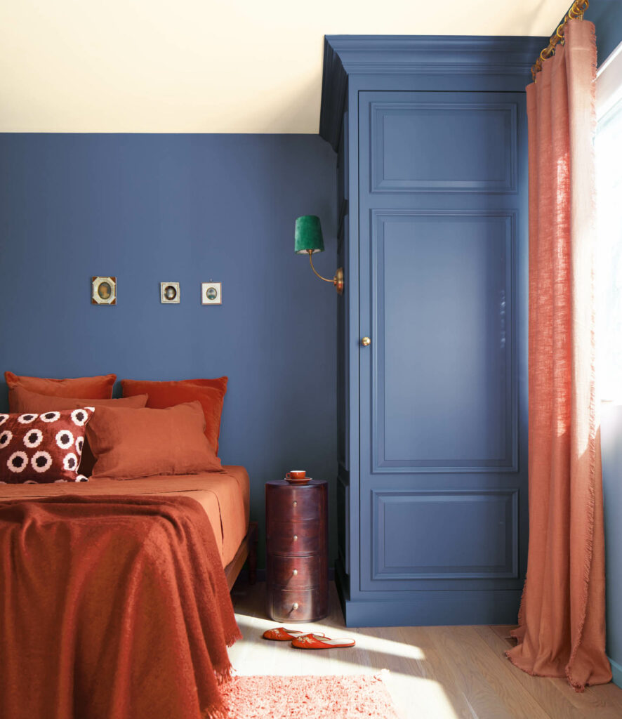 A bedroom wall painted in Benjamin Moore's Blue Nova