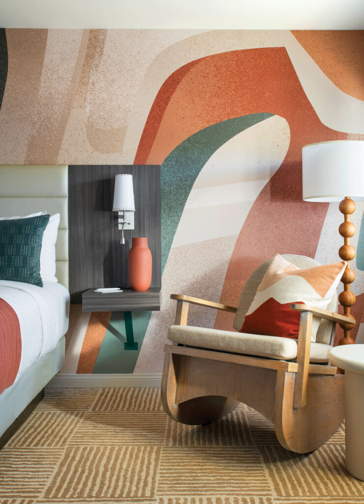 an abstract colorful vinyl wallcovering in a guest room