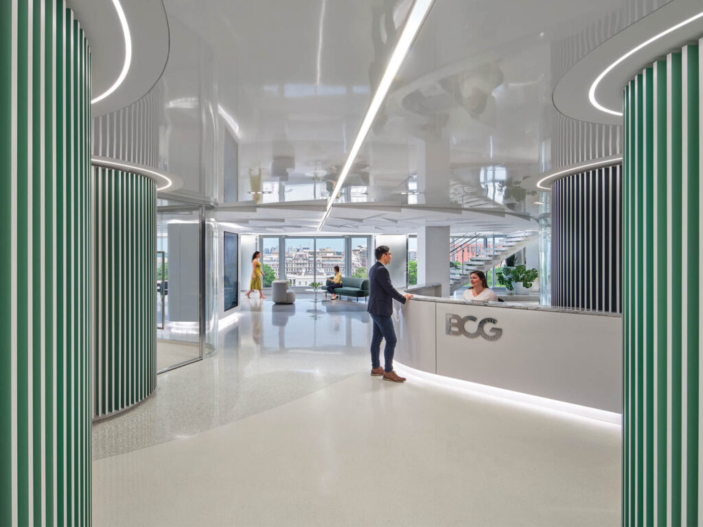 office reception with bright white lights and green dividers