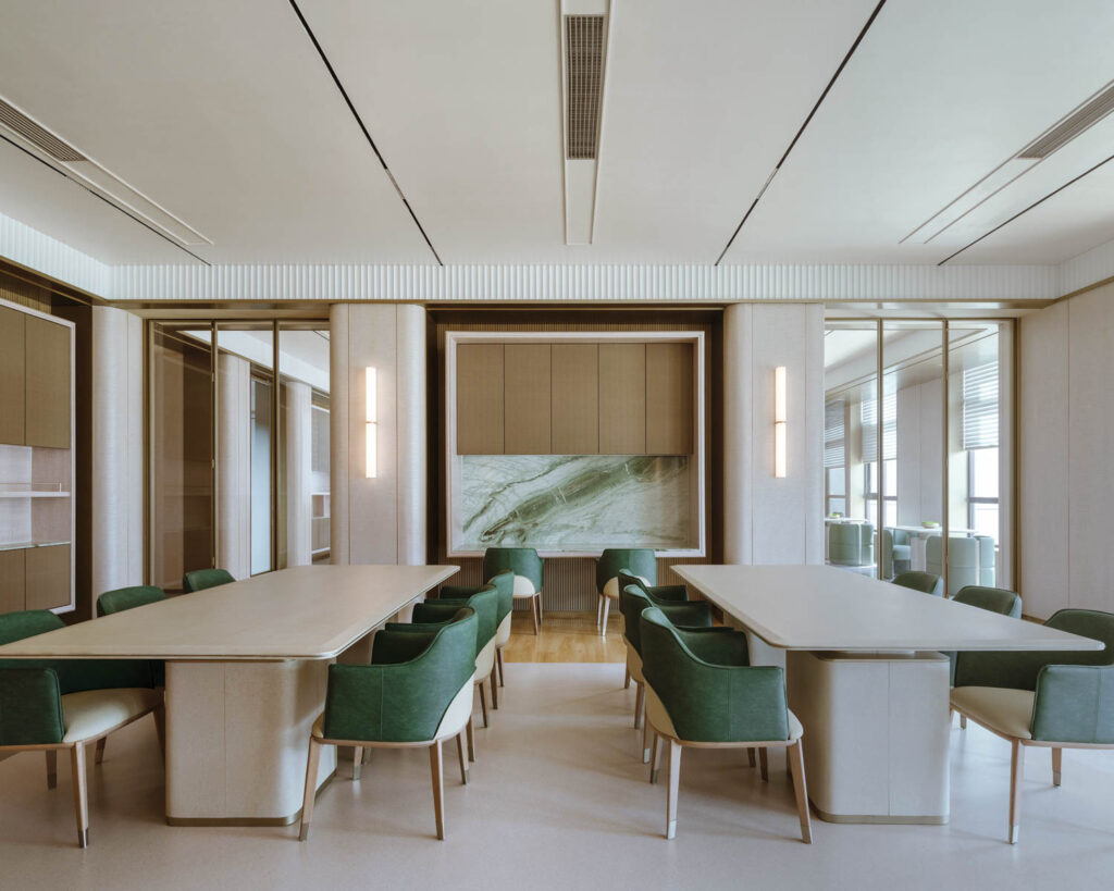 conference room with neutral walls and green chairs
