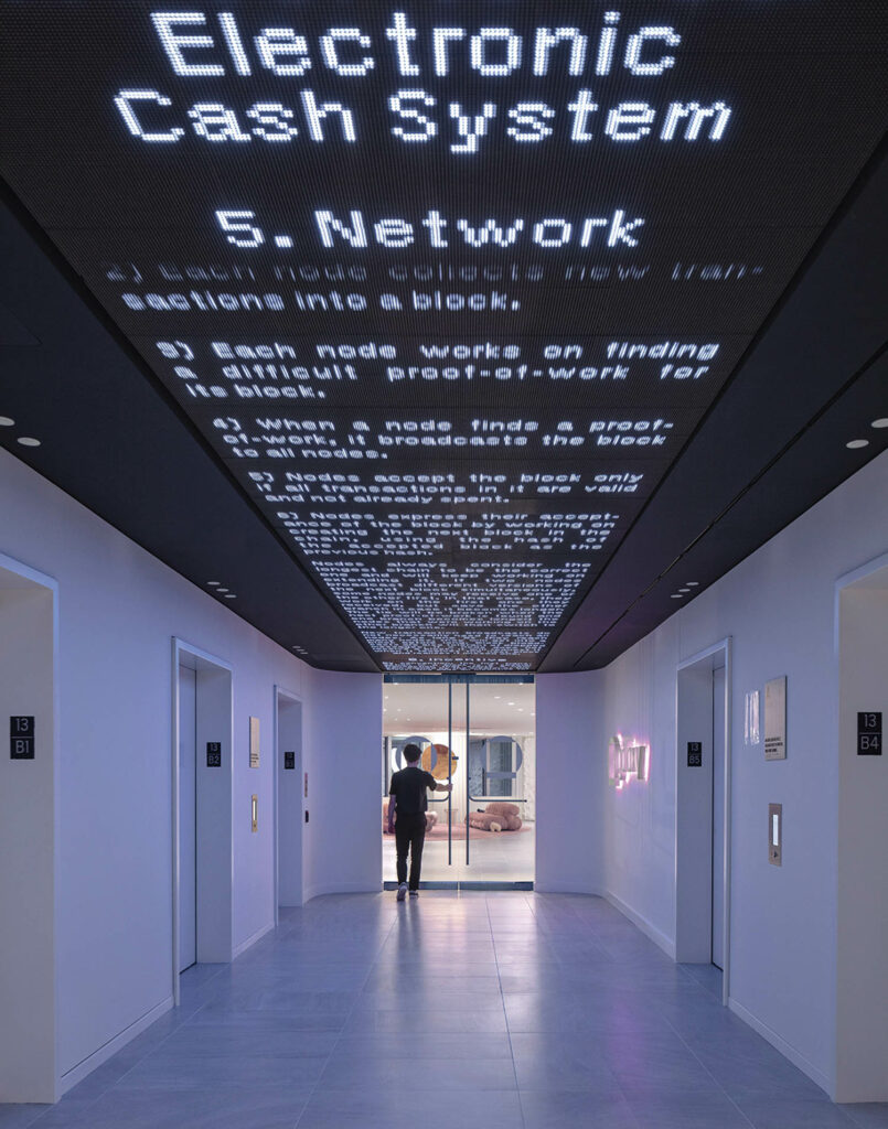an office hall with messages on the ceiling
