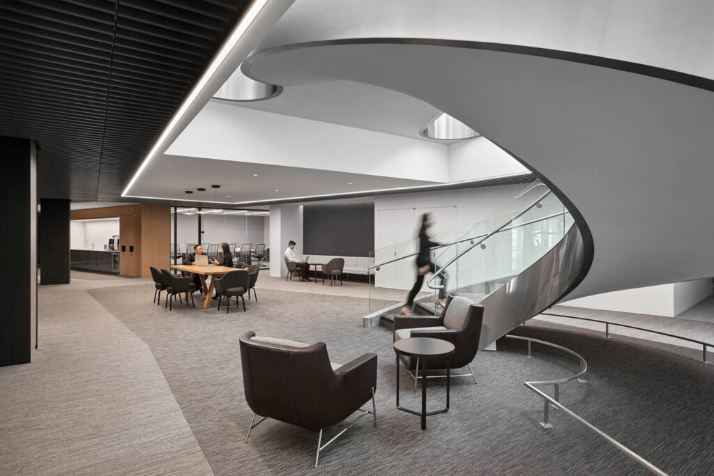 A sculptural gray stair in the operational HQ