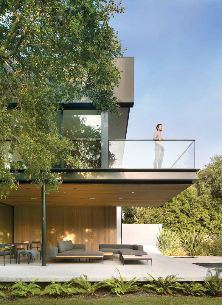 a residence in california surrounded by redwoods and oak trees