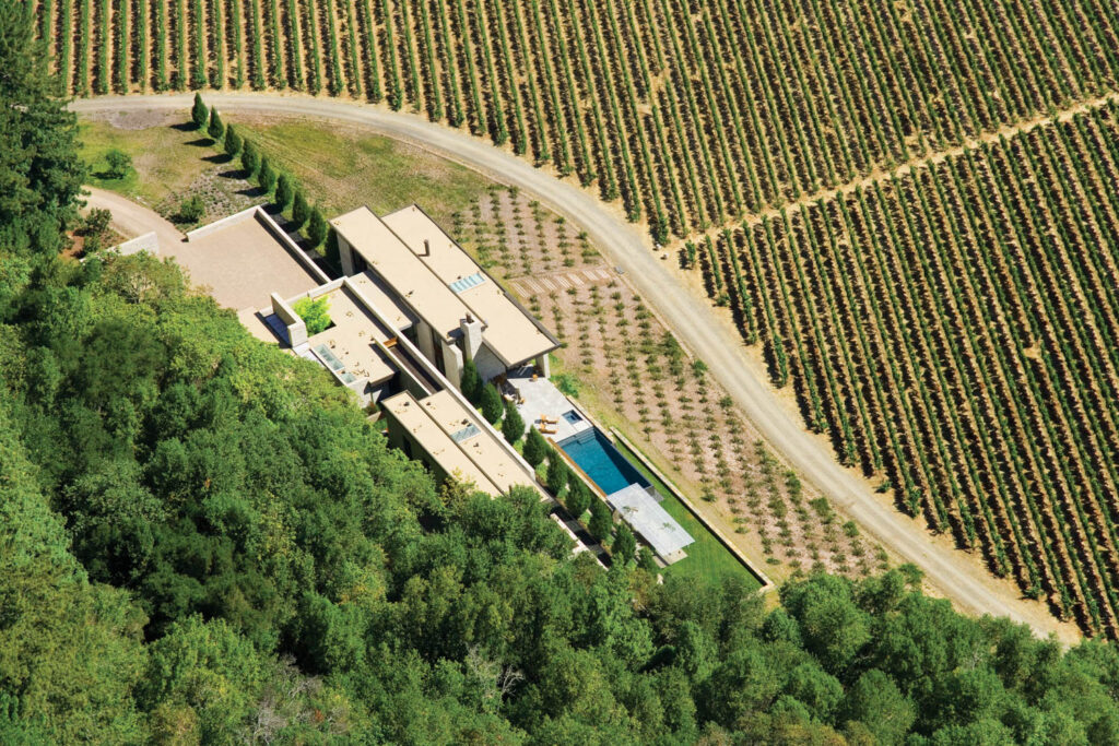 Organized around a long reflecting pool, a 2004 vineyard estate in Sonoma, California