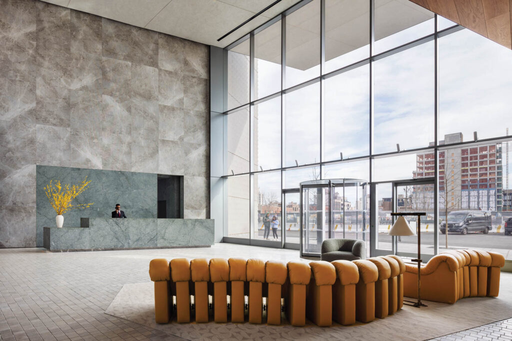 a granite reception desk at Eagle + West, a residential complex in Brooklyn