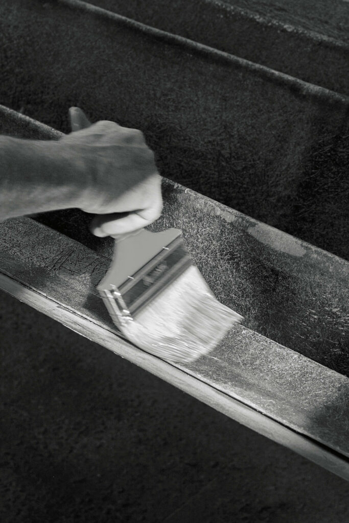black silk fabric being coated in resin