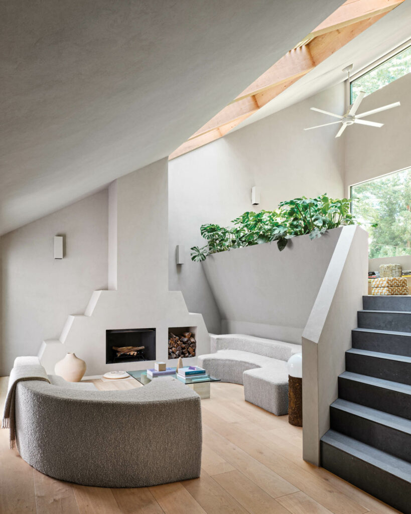 inside a bright and airy living area with a staircase