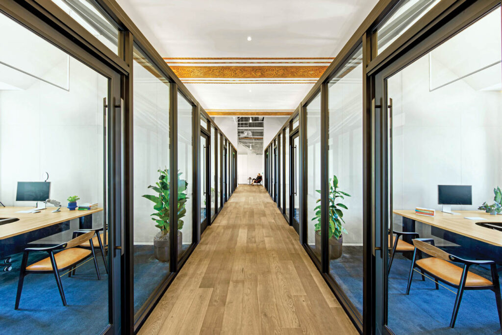 office hallway with glass paneled offices