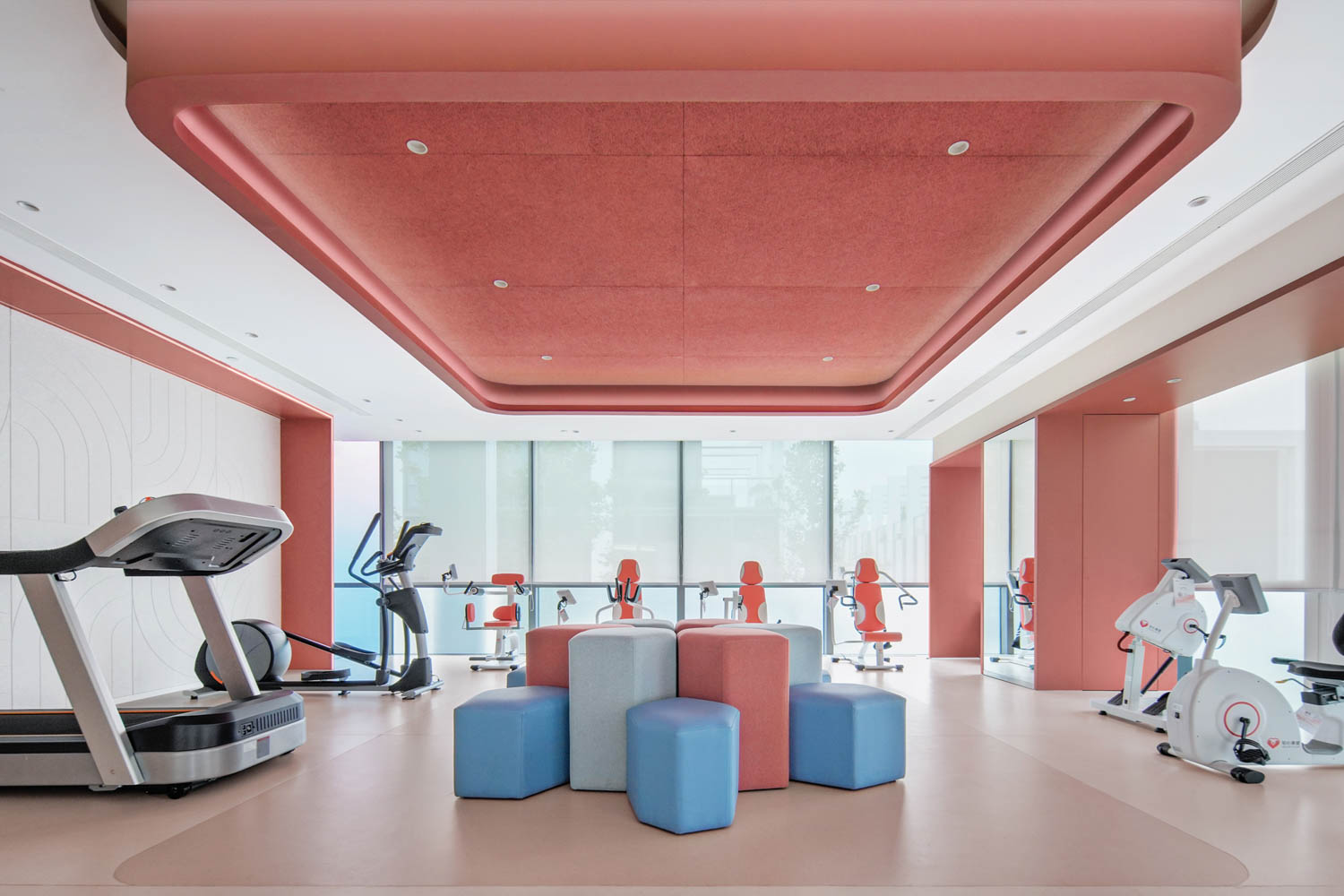 gym room with red ceilings and block in the middle