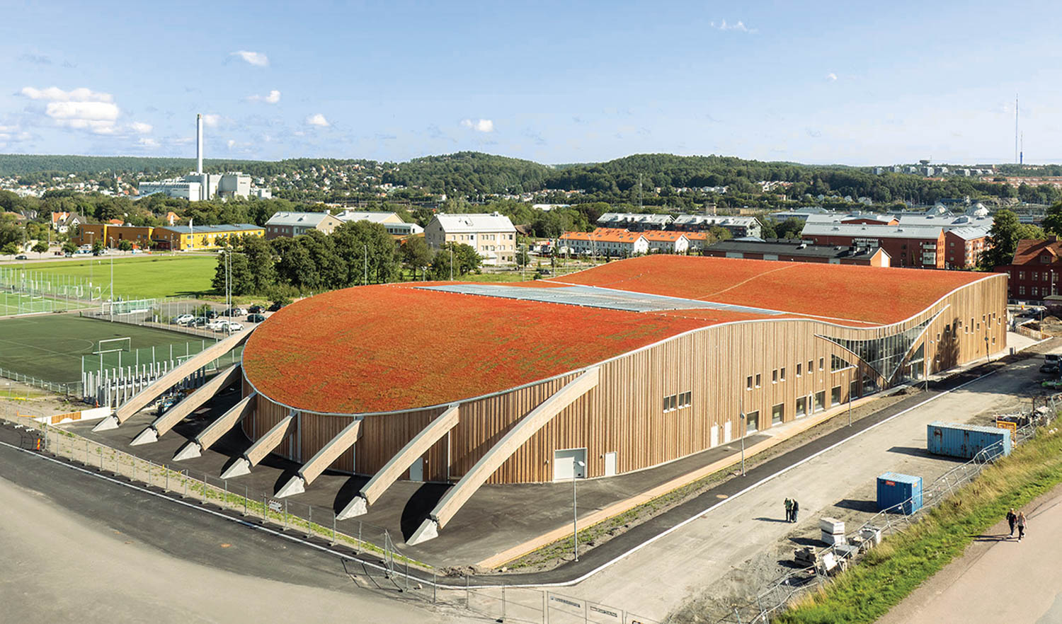 aerial view of a sports arena with orange roof