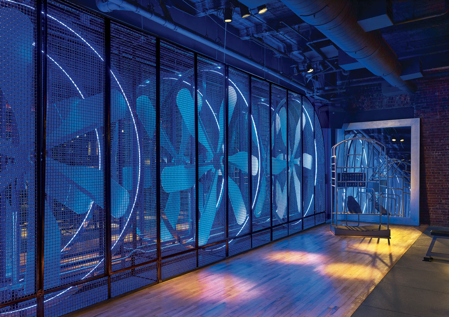 room with multiple large fans and blue lights
