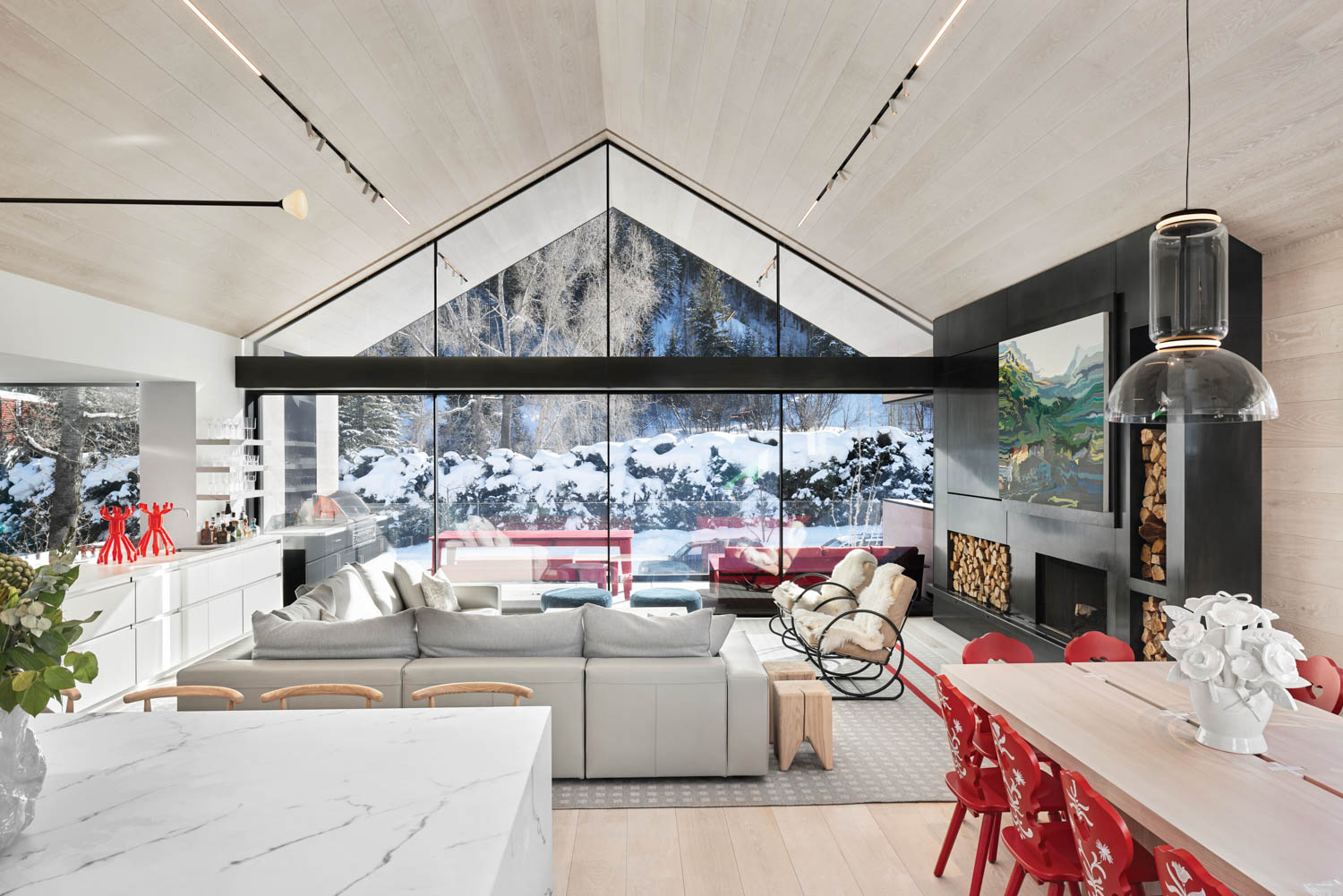 living room with high ceilings, couches and view of the scenery