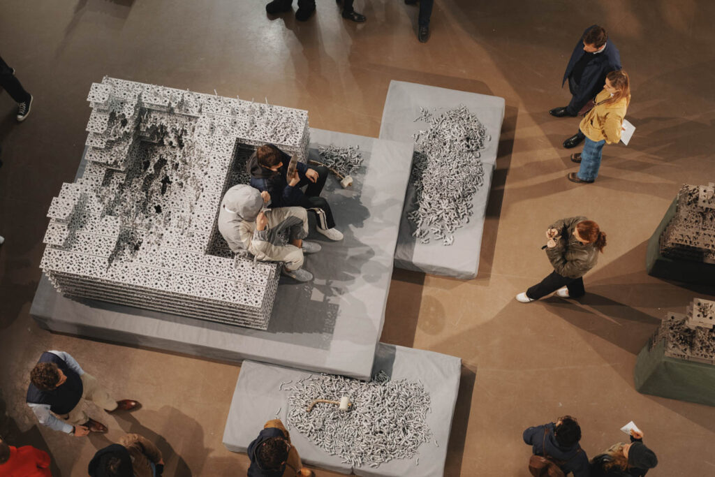 aerial view of grey block chairs with people sitting on them