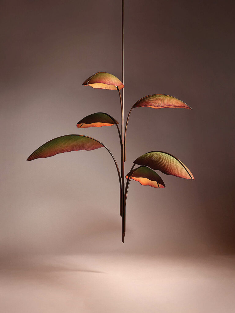 bronze plant sculpture that seems to be floating