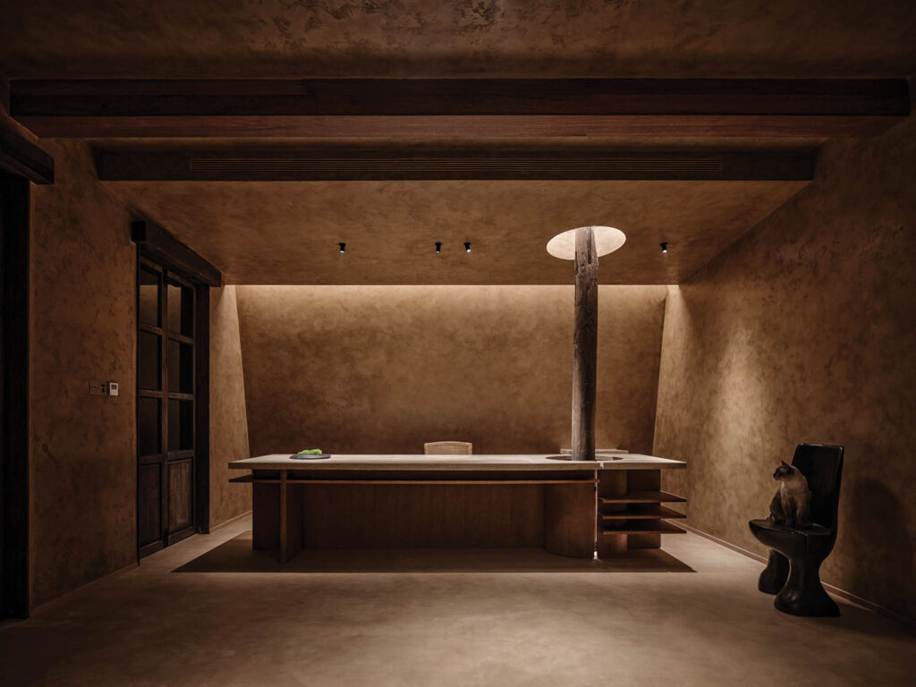 front desk lobby with brown desk and moody palette