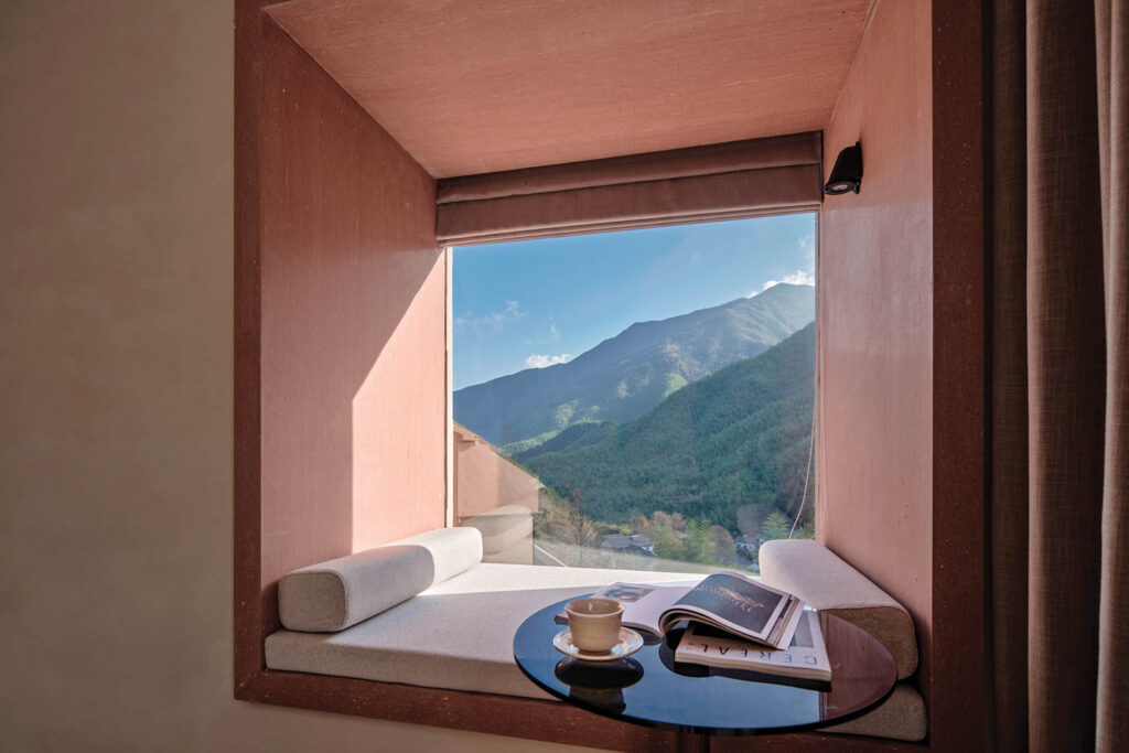 hotel room with block pillow and nook facing the scenery