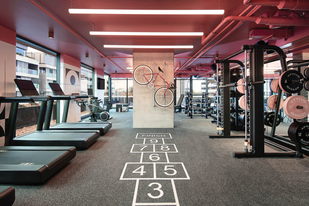 gym area with hopscotch court and workout machines